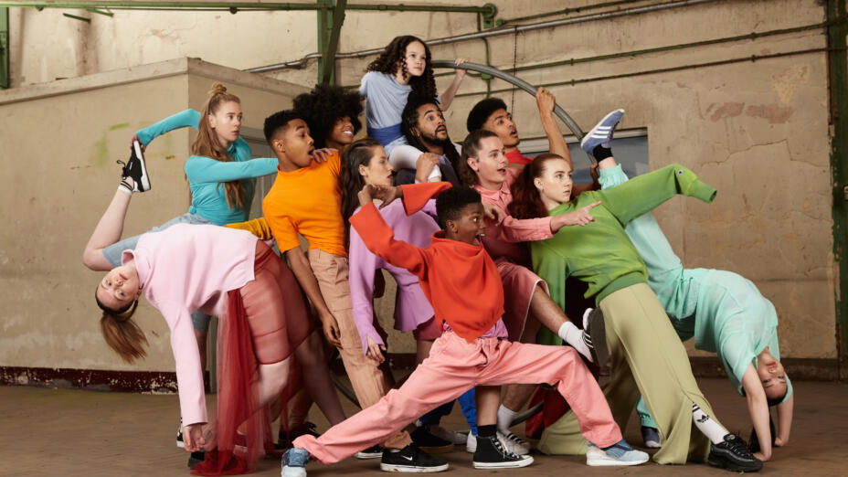 Group of young performers in brightly coloured outfits from Jukebox Collective. Image: Jukebox Collective. Photo by Katja Mayer