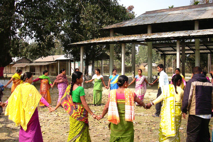 Group of men and women in saris taking part in Ashas training at Makra Panbari.