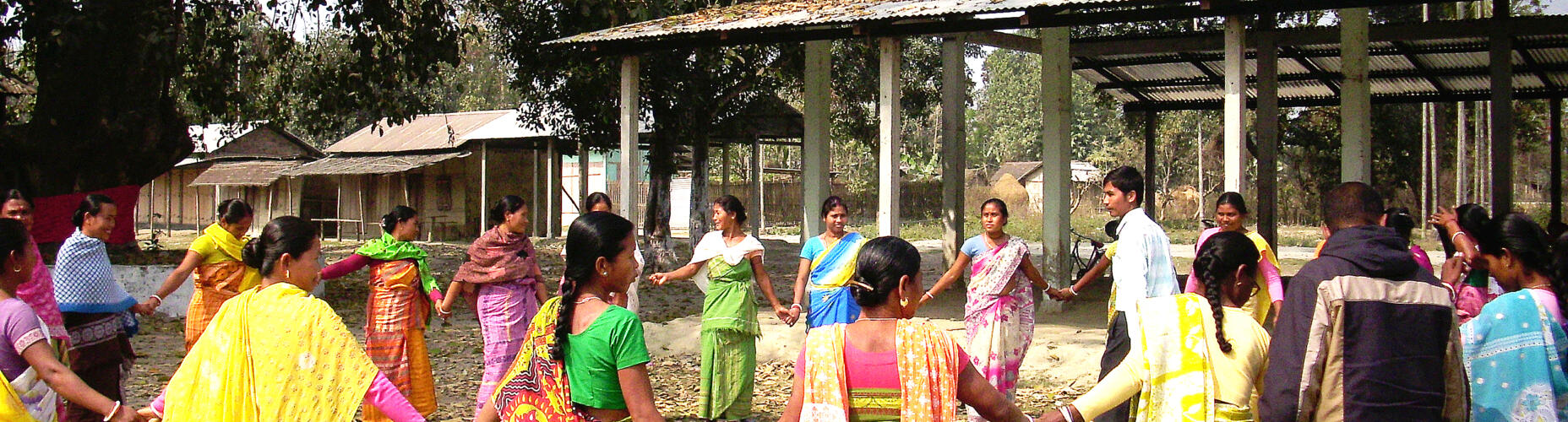 Group of men and women in saris taking part in Ashas training at Makra Panbari.