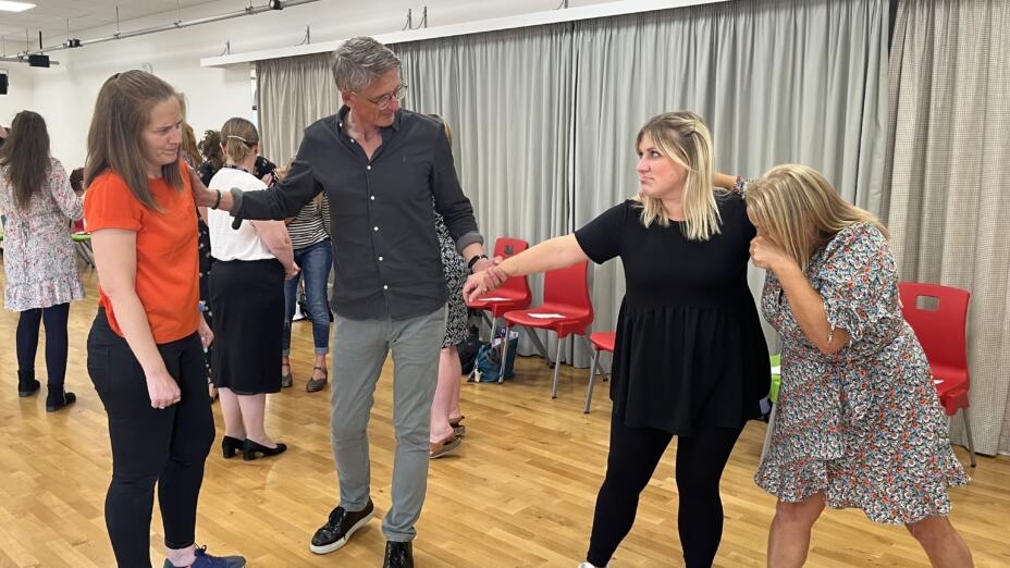 One man and three women take part in a teacher CPD session