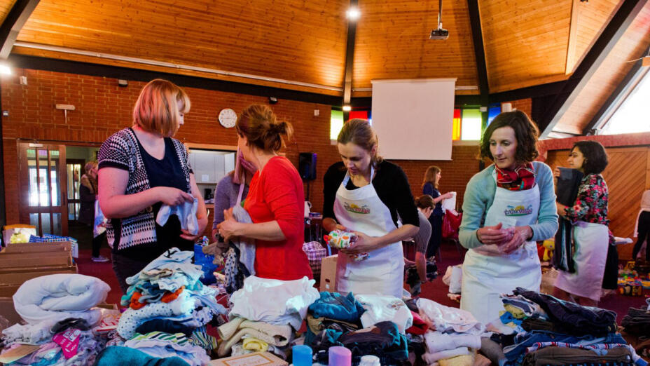 Volunteers working at Little Village baby bank