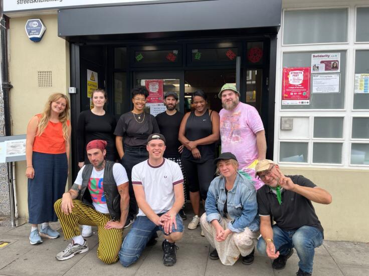 Staff members group together outside the Museum of Homelessness' Summer Hub